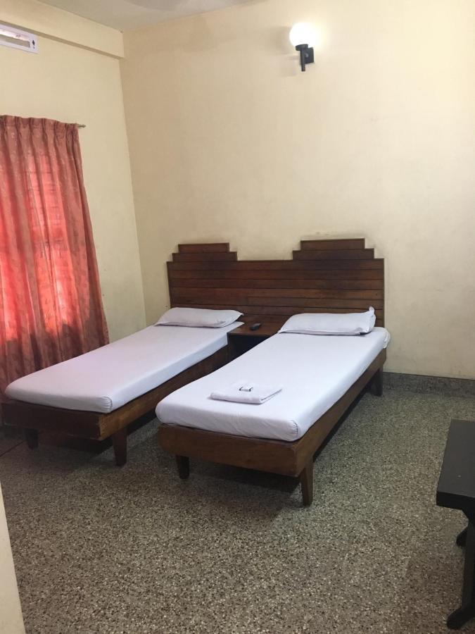 Nellimoottil Guest House Kottayam Phòng bức ảnh